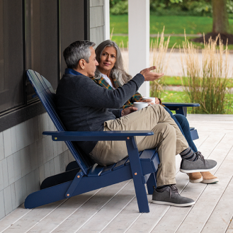 A retired couple relaxing on their porch.