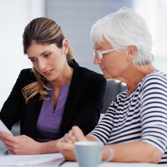 Financial professional reviewing the investment options available with the SecurePay Pro income benefit with her client.