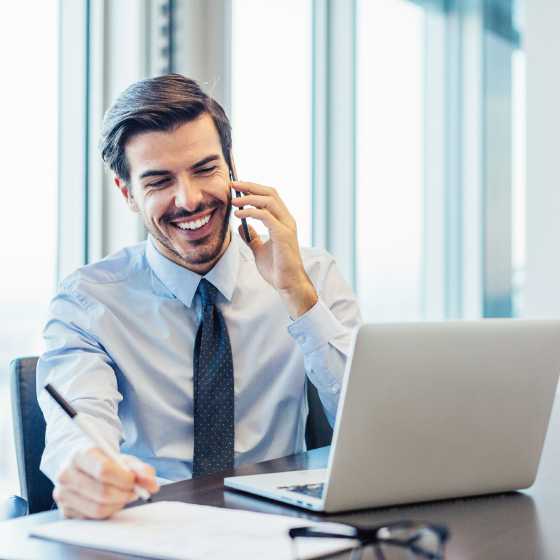 Financial advisor on the phone with his client discussing investing with the SecurePay Life benefit.