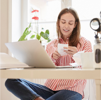 Client reviews a note to call her financial advisor to discuss a Protective Investors Benefit Advisory Variable Annuity NY, a fee-based solution for tax-deferred investing.