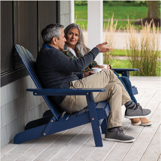 A retired couple enjoy spending time on their porch.