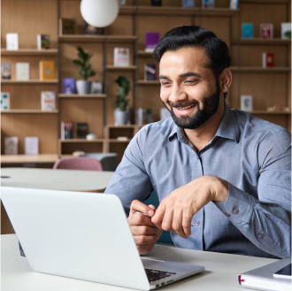 Financial professional using a laptop to access business tools and resources from Protective.