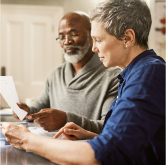 A financial professional meeting with a woman about her retirement goals.